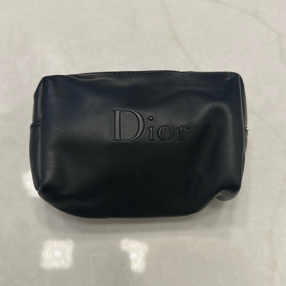 Small Christian Dior black bag. New/ never used. Star zipper.